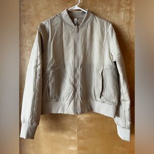 Lululemon reversible bomber jacket. NWOT.  Trench color in size 12.